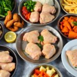 Various chicken thigh meal prep dishes arranged on a table