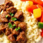 A well-prepared beef and rice meal with colorful vegetables