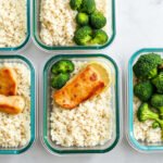 Meal prep containers with chicken, rice, and broccoli