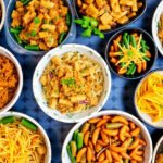 An array of colorful Asian meal prep dishes